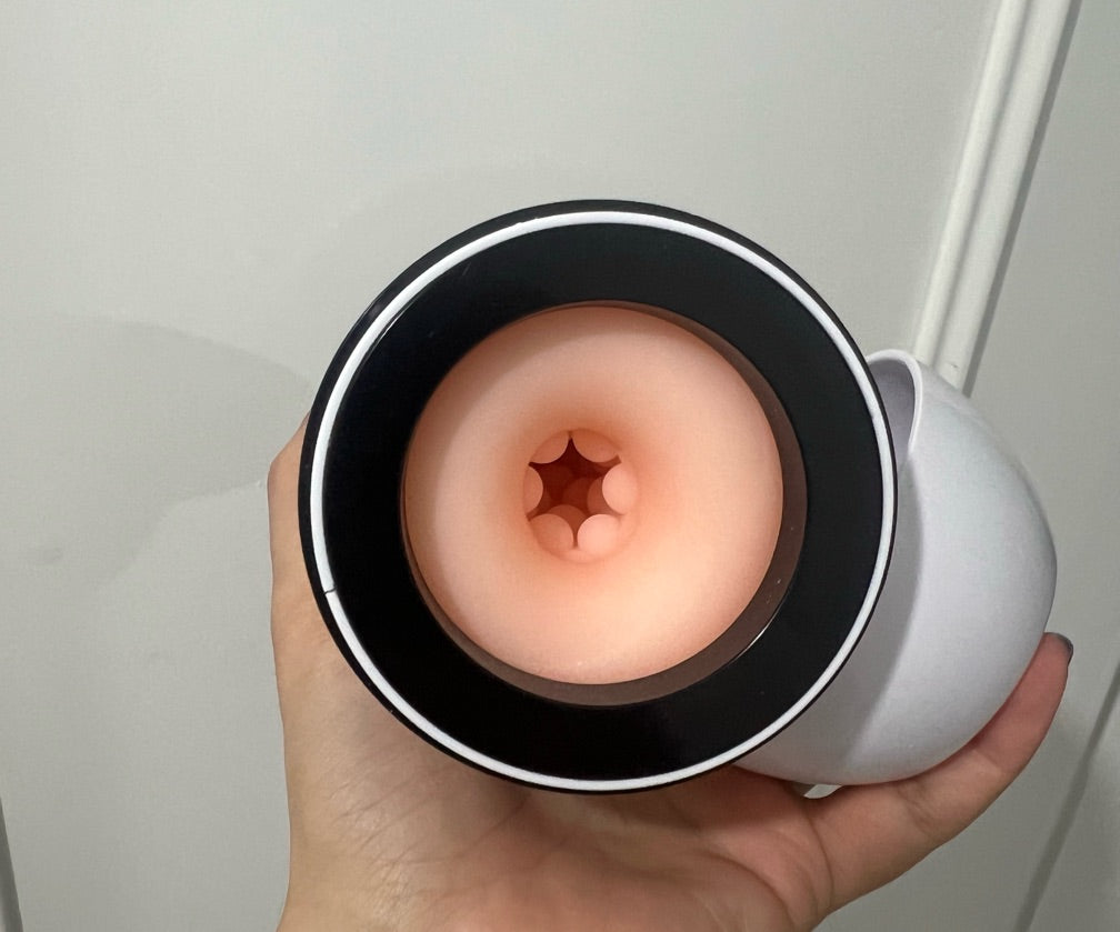 Electric masturbator with earphones