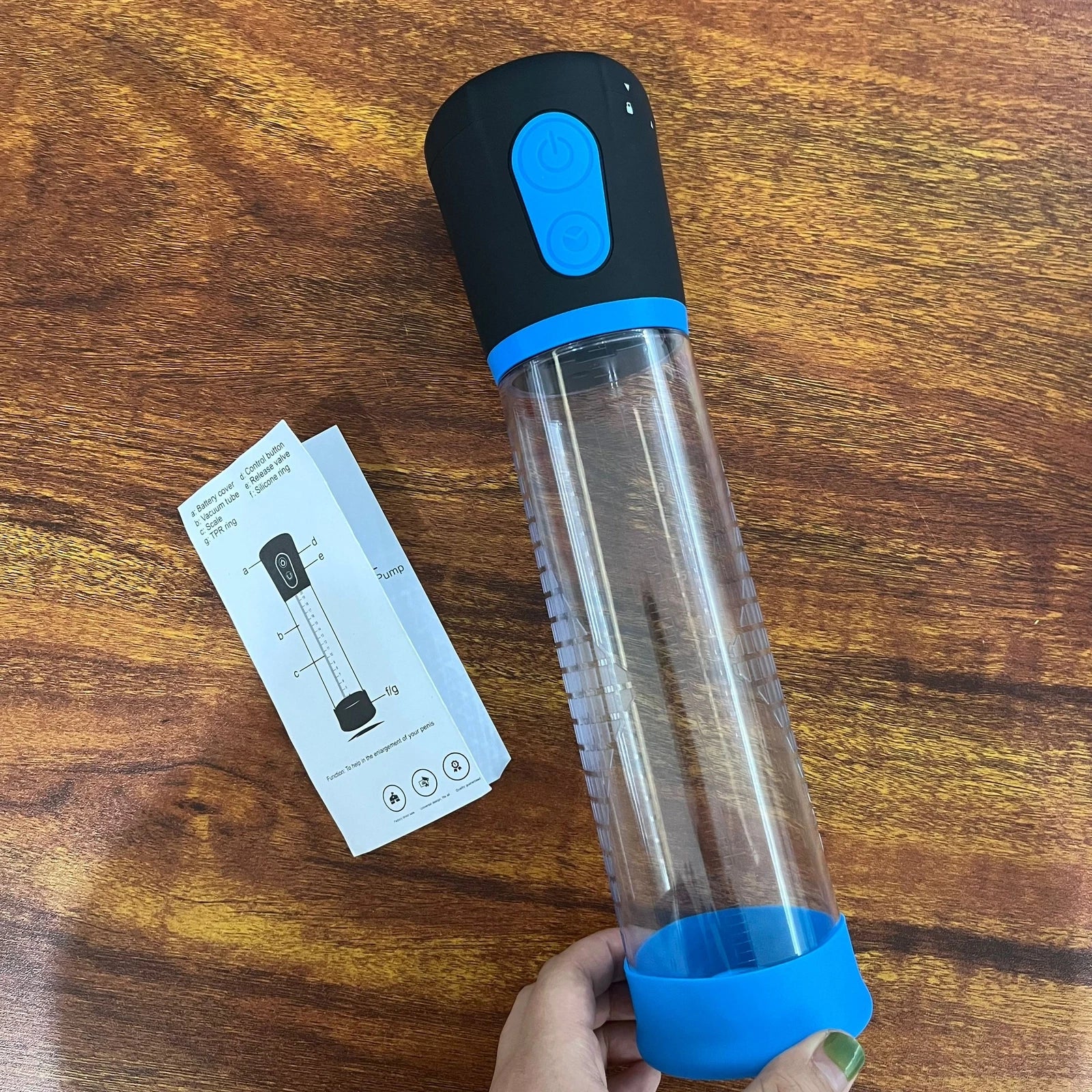 Handheld electric penis pump device with control remote and cylinder close view sex toys Lebanon